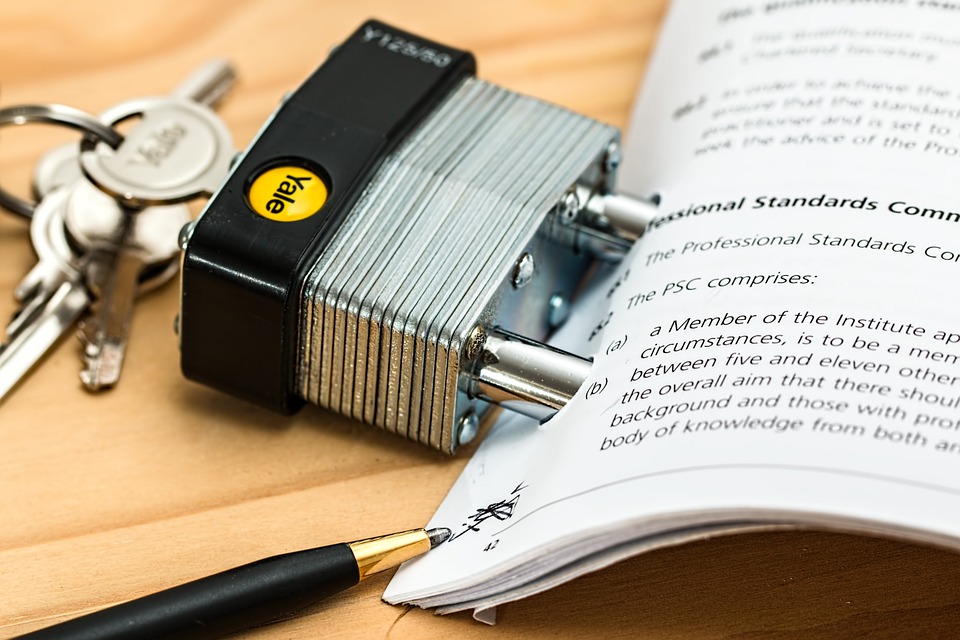 padlock with keys on a legal document