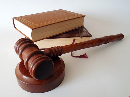 judge's gavel and judiciary books
